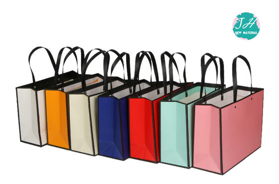 los 32*11*38cm CMYK colorean bolsos que hacen compras de papel impresos de lujo